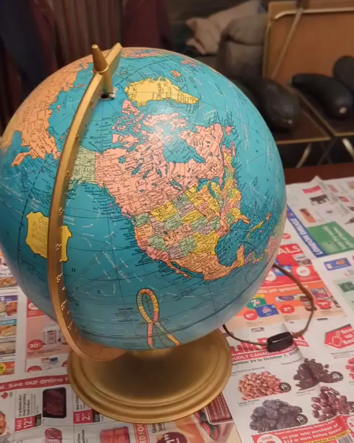 A frame from the phone video of the desk globe.